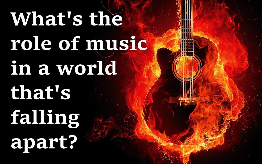 A guitar in flames with the words " what 's the purpose of music in this world it's burning heart ?" written below.