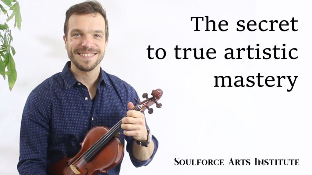 A man holding a violin with the words " soulforce art studio " written on it.